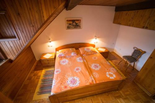 an overhead view of a bedroom with a bed and a chair at Green Garden Apartments Soklič in Bohinj