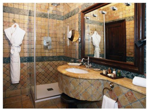 a bathroom with a sink and a shower at Relais Todini - Residenza d'epoca - Luxury Historic house in Todi