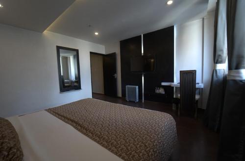 Postel nebo postele na pokoji v ubytování Hotel JSR Continental