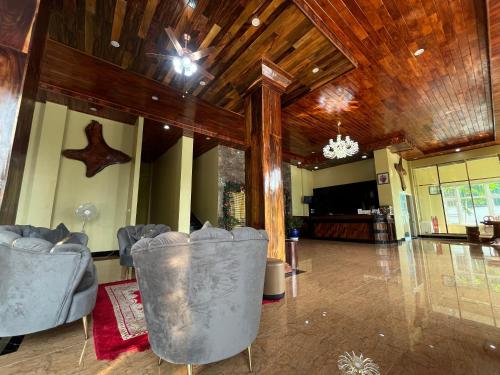 a large lobby with chairs and a chandelier at Kep Sea View Hotel & Sky Bar in Kep