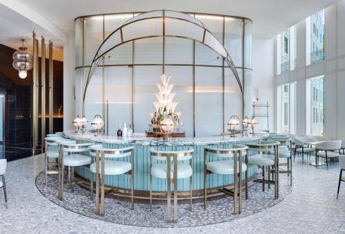 a large dining room with a table and chairs at Waldorf Astoria Las Vegas in Las Vegas