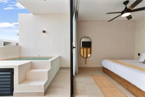Ένα ή περισσότερα κρεβάτια σε δωμάτιο στο Guest INN Home - Elements Suites