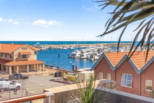 a view of a marina with boats in the water at Nautica Residences Hillarys in Perth