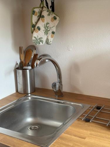 a stainless steel sink in a kitchen with a counter at Home on the beach Vastadi in Mandrákion