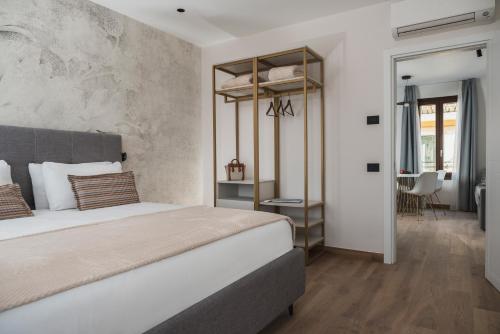 a bedroom with a bed and a room with a table at Palazzo dei Guardiani in Venice