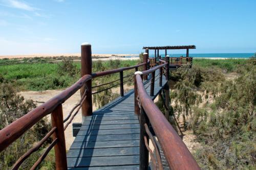 a wooden boardwalk leading down to the beach at Stiltz Guest House in Swakopmund