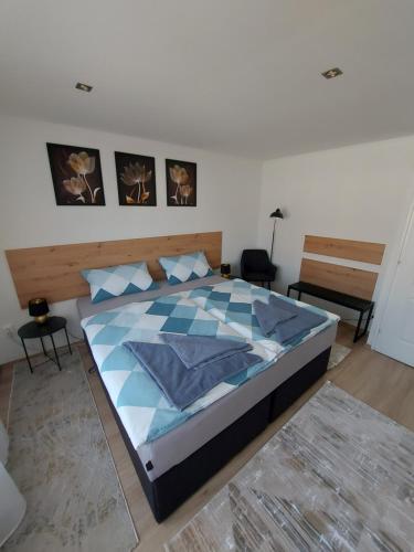 a bedroom with a large bed in a room at nani apartman in Vecsés