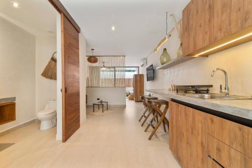 Η κουζίνα ή μικρή κουζίνα στο Guest INN Home - Elements Suites
