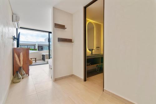 Ένα ή περισσότερα κρεβάτια σε δωμάτιο στο Guest INN Home - Elements Suites