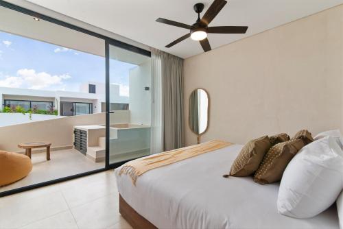 Ένα ή περισσότερα κρεβάτια σε δωμάτιο στο Guest INN Home - Elements Suites