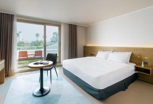 Ένα ή περισσότερα κρεβάτια σε δωμάτιο στο Bloom Hotel