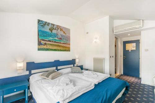 Letto o letti in una camera di Bike & Wind Hotel Villa Maria