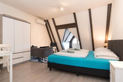 a bedroom with a bed in a room with a window at RedLight District Smokers Friendly Private Studio in Amsterdam