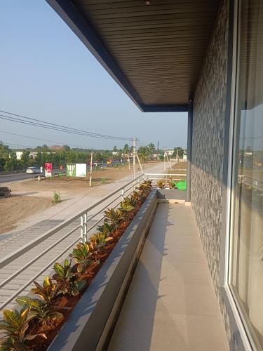 a view from a window of a building with plants at Hotel Surya Grand in Bāpatla