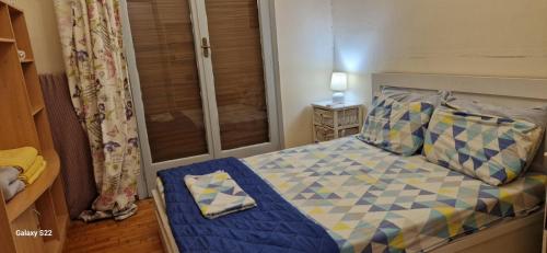 Posteľ alebo postele v izbe v ubytovaní Feels Like Home 1