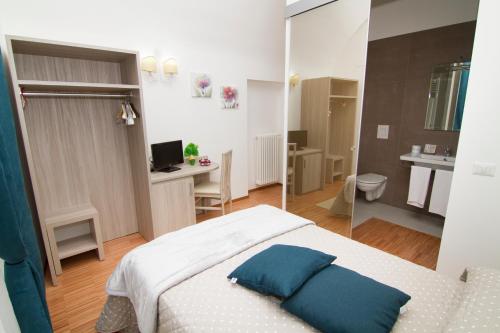 Ένα ή περισσότερα κρεβάτια σε δωμάτιο στο Al Bastione Relais Suite & Rooms