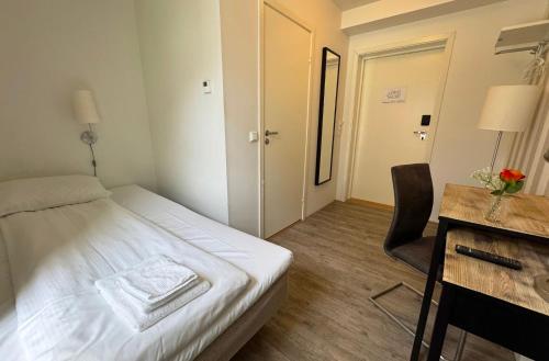 Ένα ή περισσότερα κρεβάτια σε δωμάτιο στο Jibben Hotell