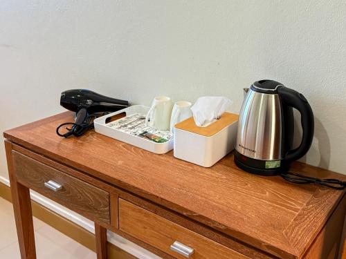 a counter with a coffee maker and a tea kettle at Sea Inn Hua Hin 55 in Hua Hin