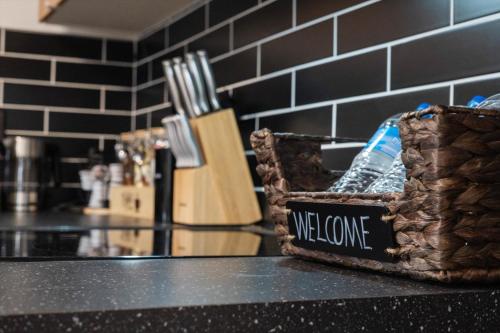 a welcome sign on a counter in a kitchen at Luxury Meets Wellness Spa Rtrt in Phoenix