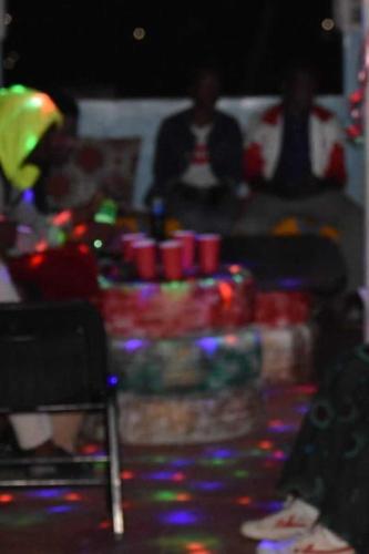 a table with a pile of cups and lights at EMMY'S HIDE AWAY in Iringa