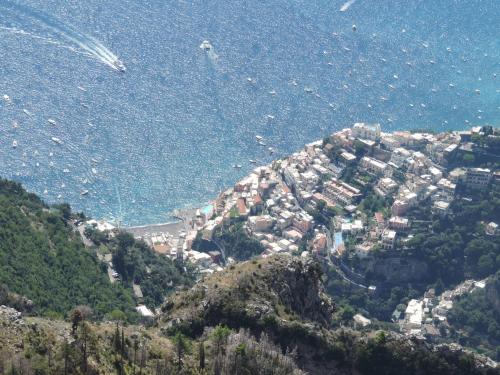 a view of a town on a hill near the water at Nido Verde in Agerola