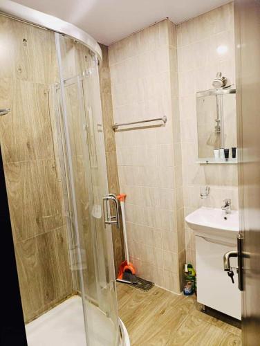 a bathroom with a shower and a sink at tribu apart hotel in Bakuriani