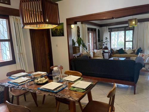 a living room with a table and a couch at Guest room 1, A home away from home in Kampala