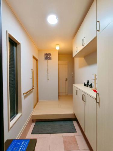 a small bathroom with a sink and a shower at 小阪雅居 in Osaka