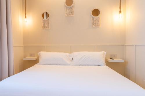 Una cama o camas en una habitación de L'Altra Chiave