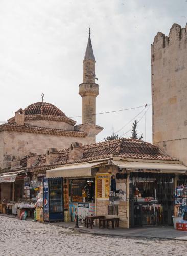 a market with a mosque in the background at ibis Adana in Adana