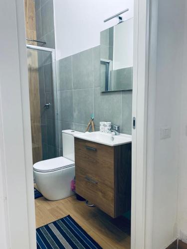 a bathroom with a sink and a toilet and a shower at Bellavista in Selva di Fasano