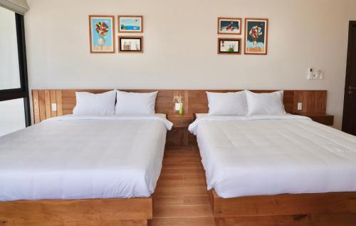 Postel nebo postele na pokoji v ubytování Coco Villa 2