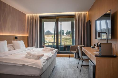 Postel nebo postele na pokoji v ubytování Amenity Hotel & Resort Česká Kanada