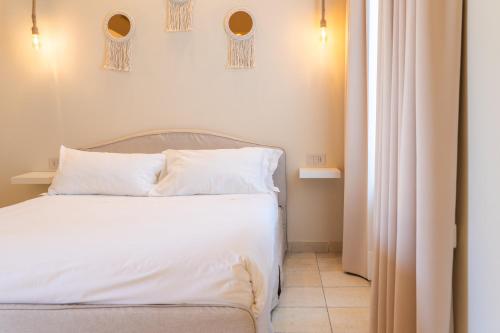 Una cama o camas en una habitación de L'Altra Chiave