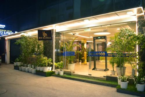 a store front with potted plants in front of it at BH Hotels Tripper Near IGI Airport in New Delhi