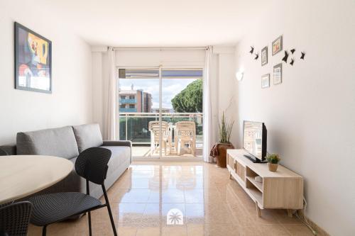 a living room with a couch and a table at Mediterranean Way - Ontario in Salou