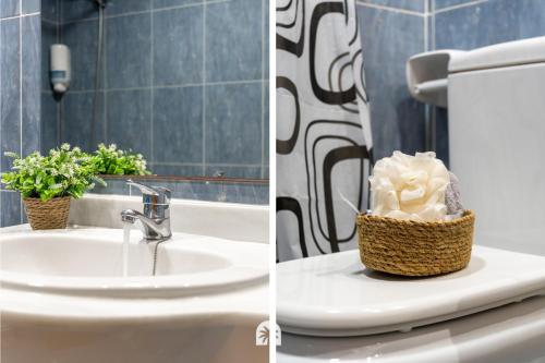 a bathroom sink with a toilet and a basket of flowers at Mediterranean Way - Ontario in Salou