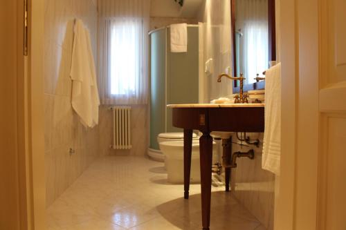 a bathroom with a sink and a toilet at L'Attico del Centro in Matera