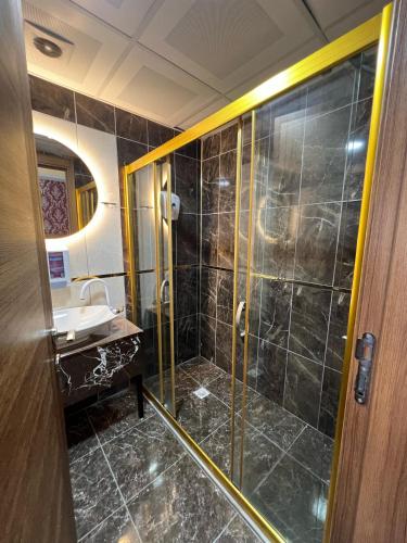 a bathroom with a shower and a sink at inDİANA HOTEL in Van
