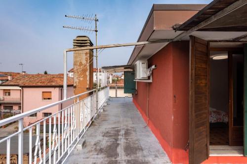 a balcony of a building with an open door at Villa Jolly Venezia - Mini Apartment in Venice