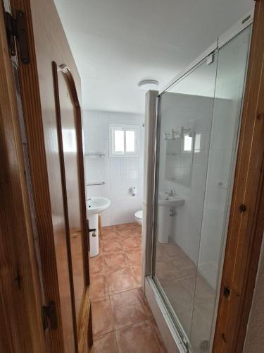 a bathroom with a shower and a toilet and a sink at 3ºA Escobar in Nerja