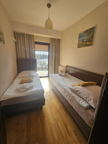 Posteľ alebo postele v izbe v ubytovaní Apartament Perła A20 nad jeziorem Pluszne