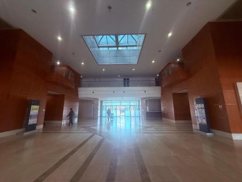 a large hall with a skylight in a building at Incheon Airport Stay Guesthouse in Incheon