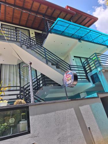 a view of a house with stairs and a balcony at Adrian Dilneth in Weligama