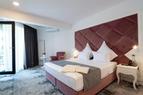 Postel nebo postele na pokoji v ubytování Hotel Simona Halep - Mamaia Nord