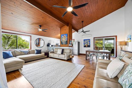 a living room with a couch and a table at Stay 4 night Pay 3 nights nights only during March 2026 in Alexandra Headland