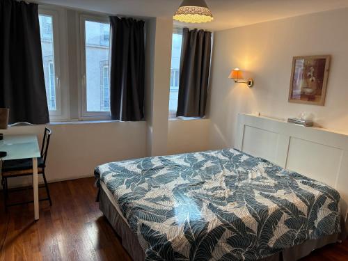 Ένα ή περισσότερα κρεβάτια σε δωμάτιο στο Appartements RESIDILAVERDE Hypercentre