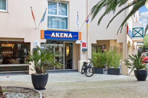 a bike parked in front of a building at Surf Club Hôtel by Akena - Grande plage in Biarritz