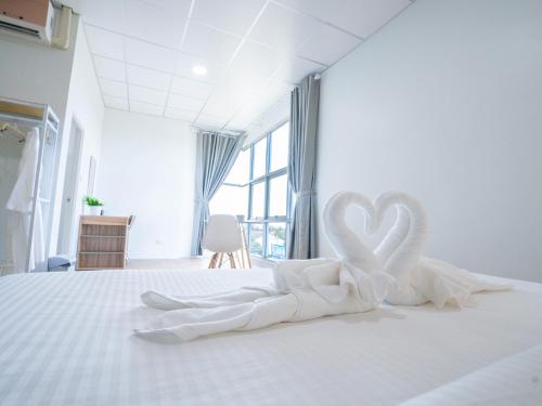 Postel nebo postele na pokoji v ubytování Savan Itecc Hotel