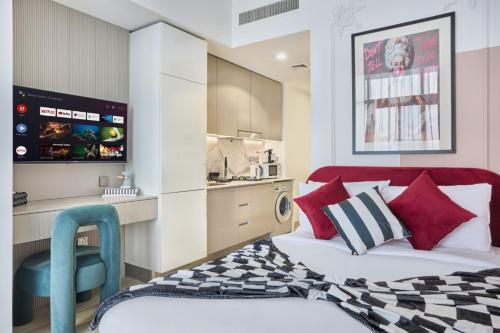 a bedroom with a bed and a blue chair at Elegant Cozy Stu Luxury Stay 10 Min Dubai Mall in Dubai